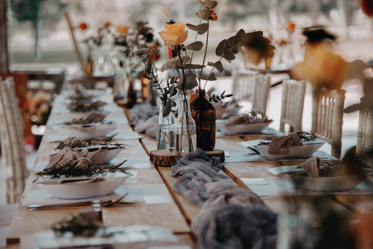 A Dining Table with Flowers in the Vase